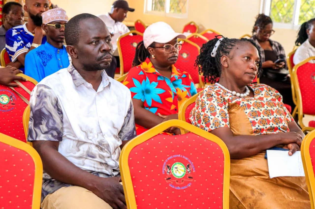 Audience members seated in rows, listening during the NAWI launch gathering.
